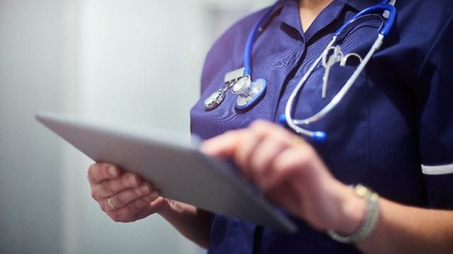 nurse holding clipboard